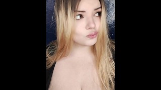Pretty girl playing with her big breasts